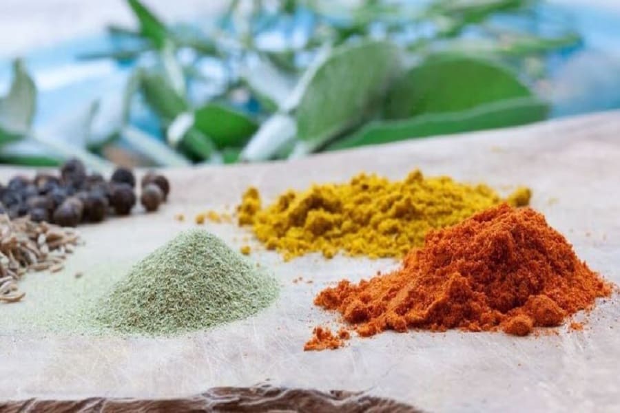 It is safe to eat food cooked with any spices, whether whole spices or powdered spices
